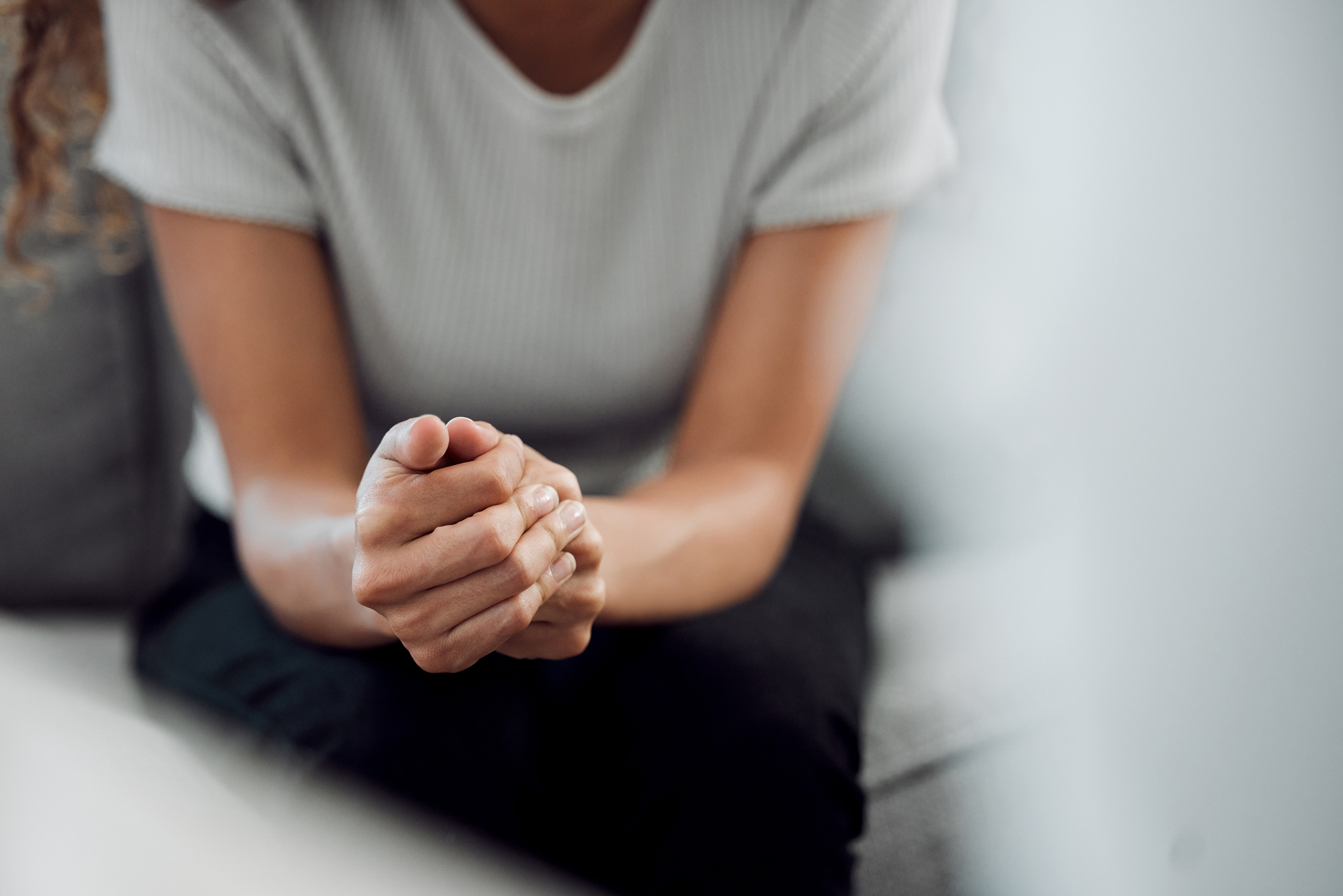 woman sitting alone and feeling anxious