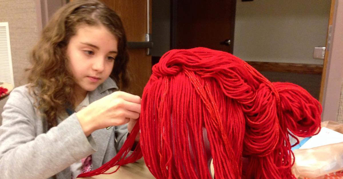 She Weaves Together A Huge Ball Of Red Yarn But Wait Til You See Why This Is Incredible