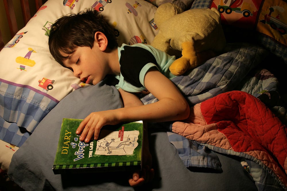 1280px-Bedtime_reading.jpg
