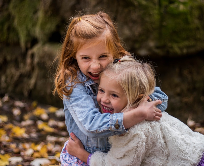 2-girls-hugging-each-other-outdoor-during-daytime-225017.jpg