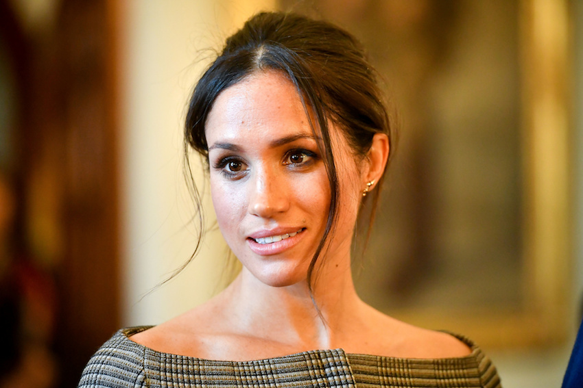 Meghan Markle chats with people inside the Drawing Room during a visit to Cardiff Castle in Cardiff