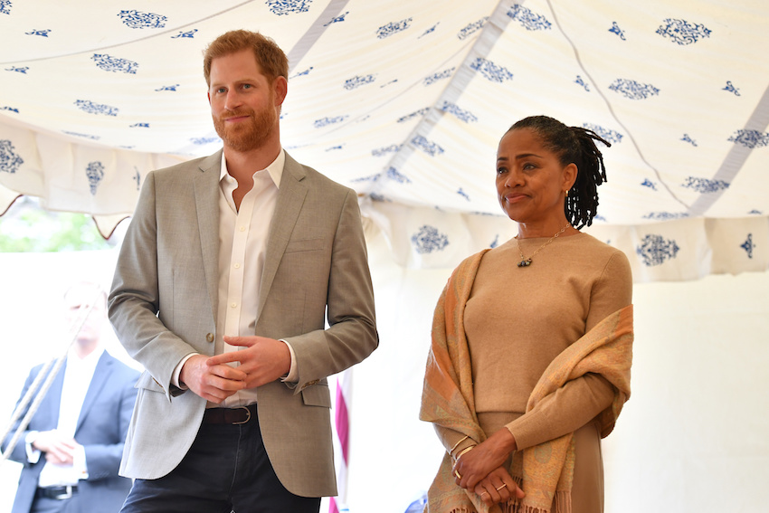 Britain's Prince Harry, and Doria Ragland listen to Meghan, Duchess of Sussex speaking at the launch of a cookbook with recipes from a group of women affected by the Grenfell Tower fire at Kensington Palace in London