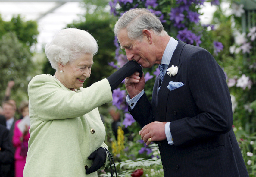FILE PHOTO: Britain's Prince Charles kisses the hand of his mother, Queen Elizabeth, during a visit to the Chelsea Flower Show in London