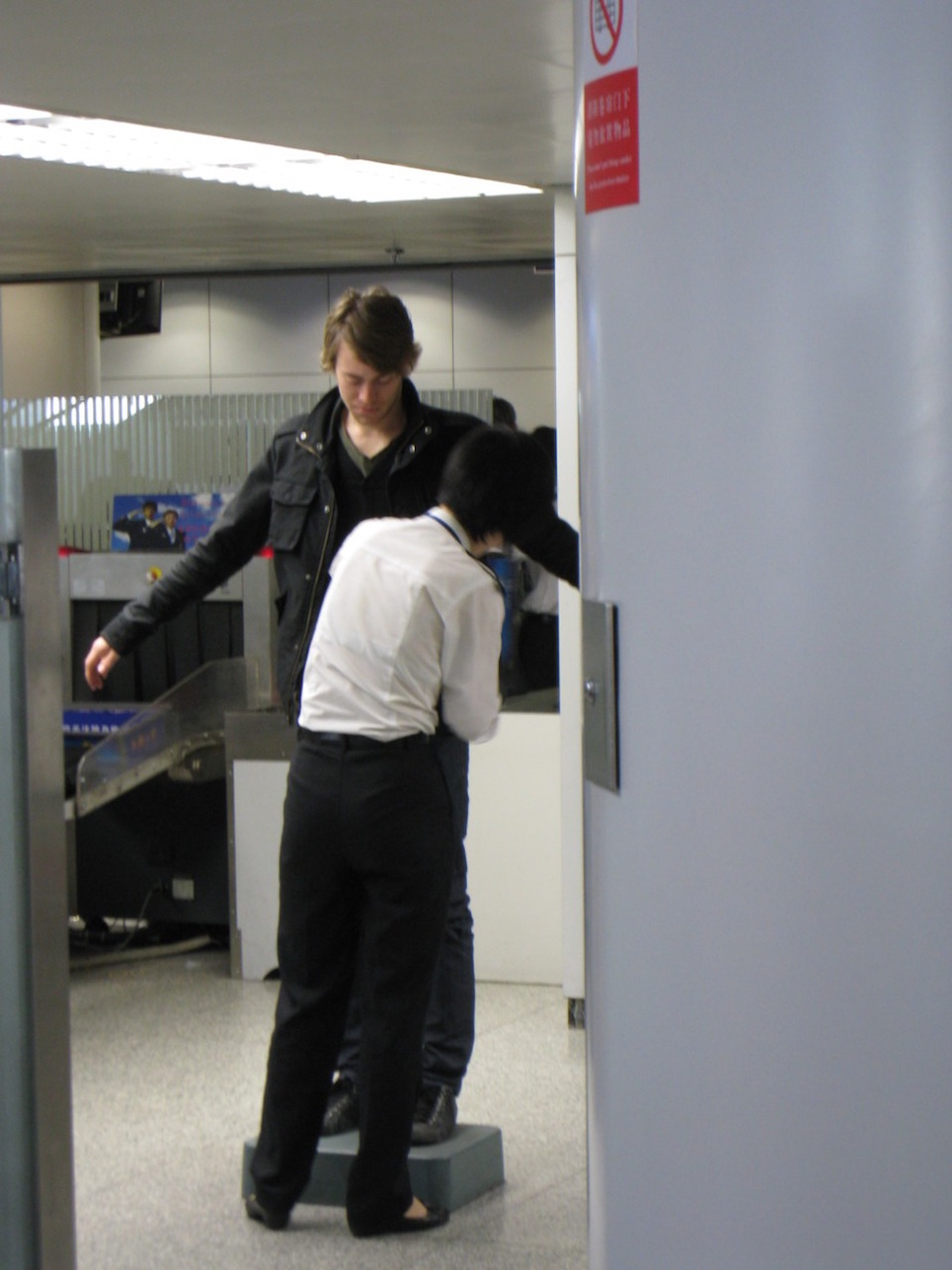 Getting searched at the airport on our way to Hangzhou
