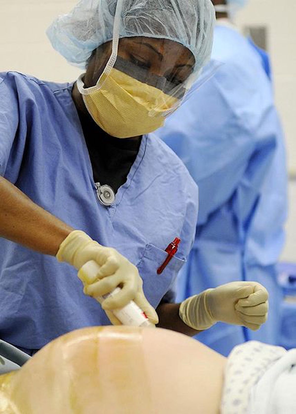 428px-US_Navy_nurse_prepares_a_mom_for_a_C-section.jpg