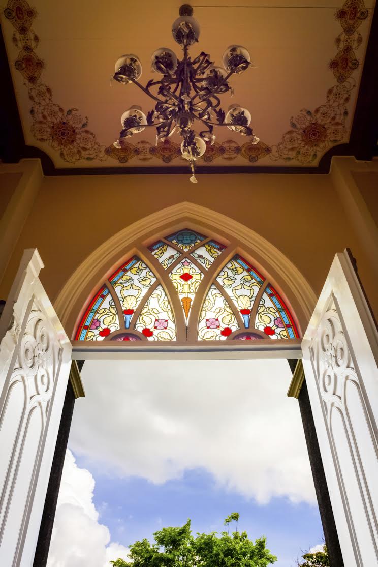 Open church door with hanging light