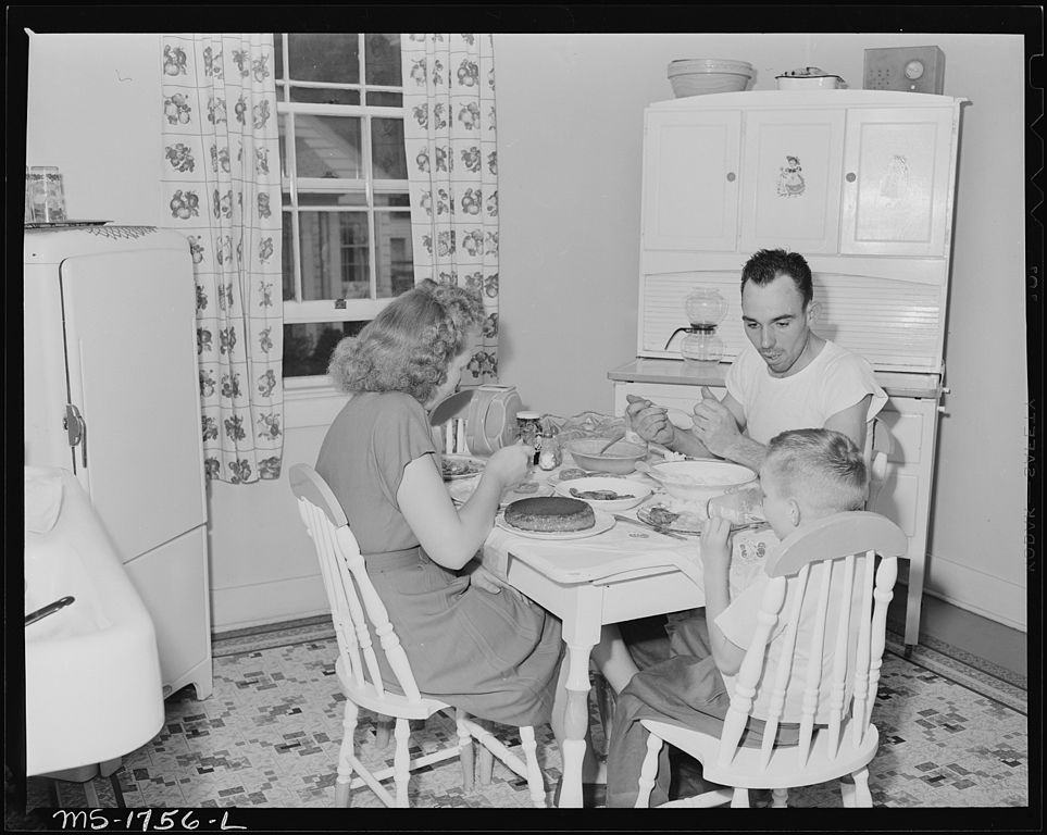 963px-P.C._Goins_section_foreman_and_family_eat_dinner_in_kitchen_in_their_home_in_company_housing_project._Koppers_Coal.jpg