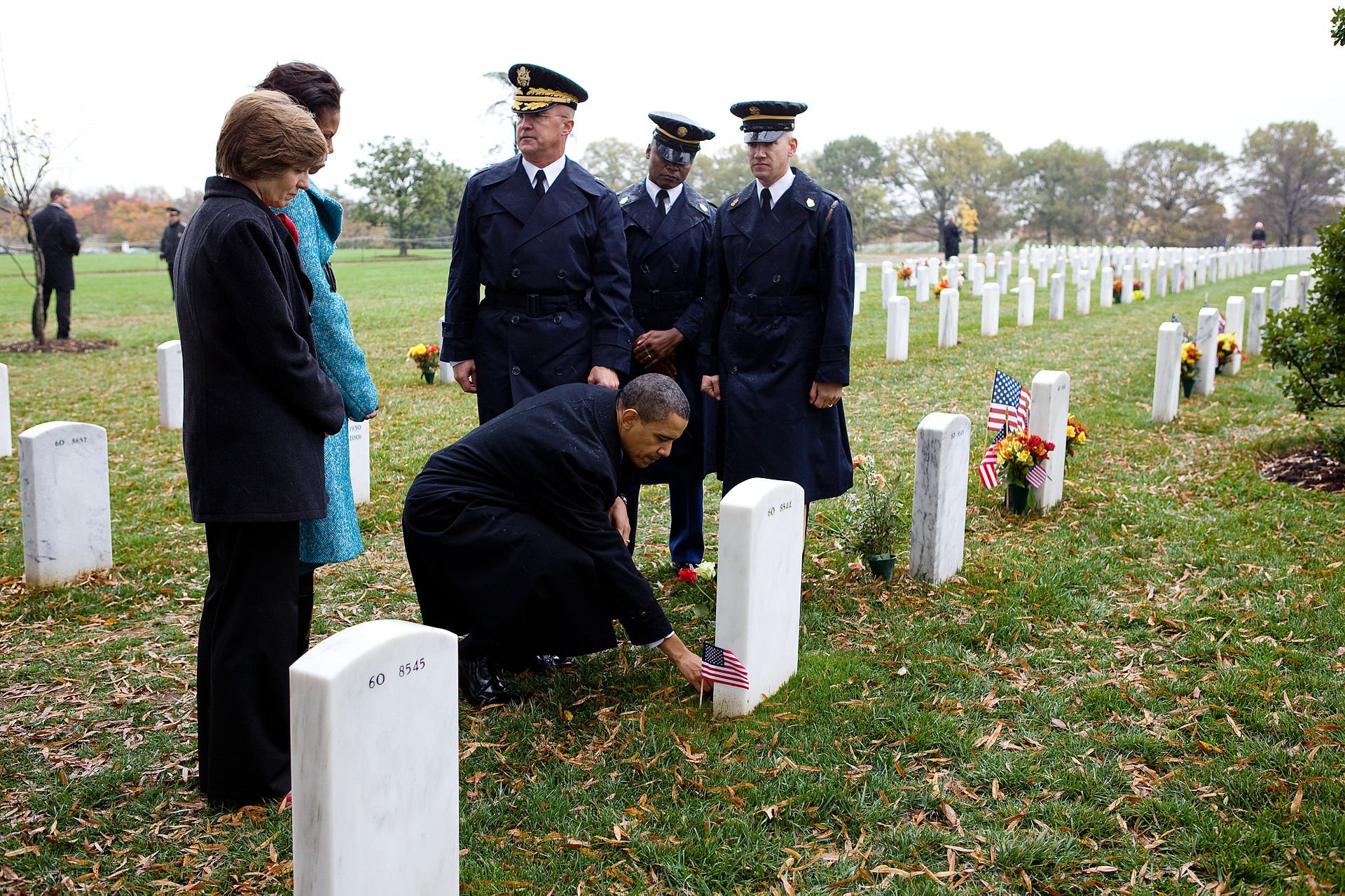 Barack_Obama_leaves_a_presidential_coin_at_the_gravesite_of_Ross_McGinnis_at_Arlington_Cemetery.jpg