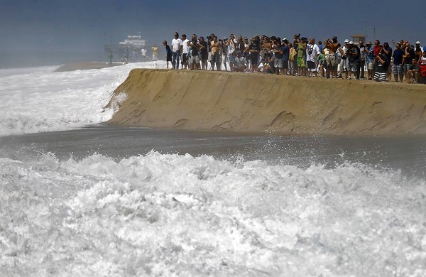 Surf pounds the Wedge at Newport Beach.