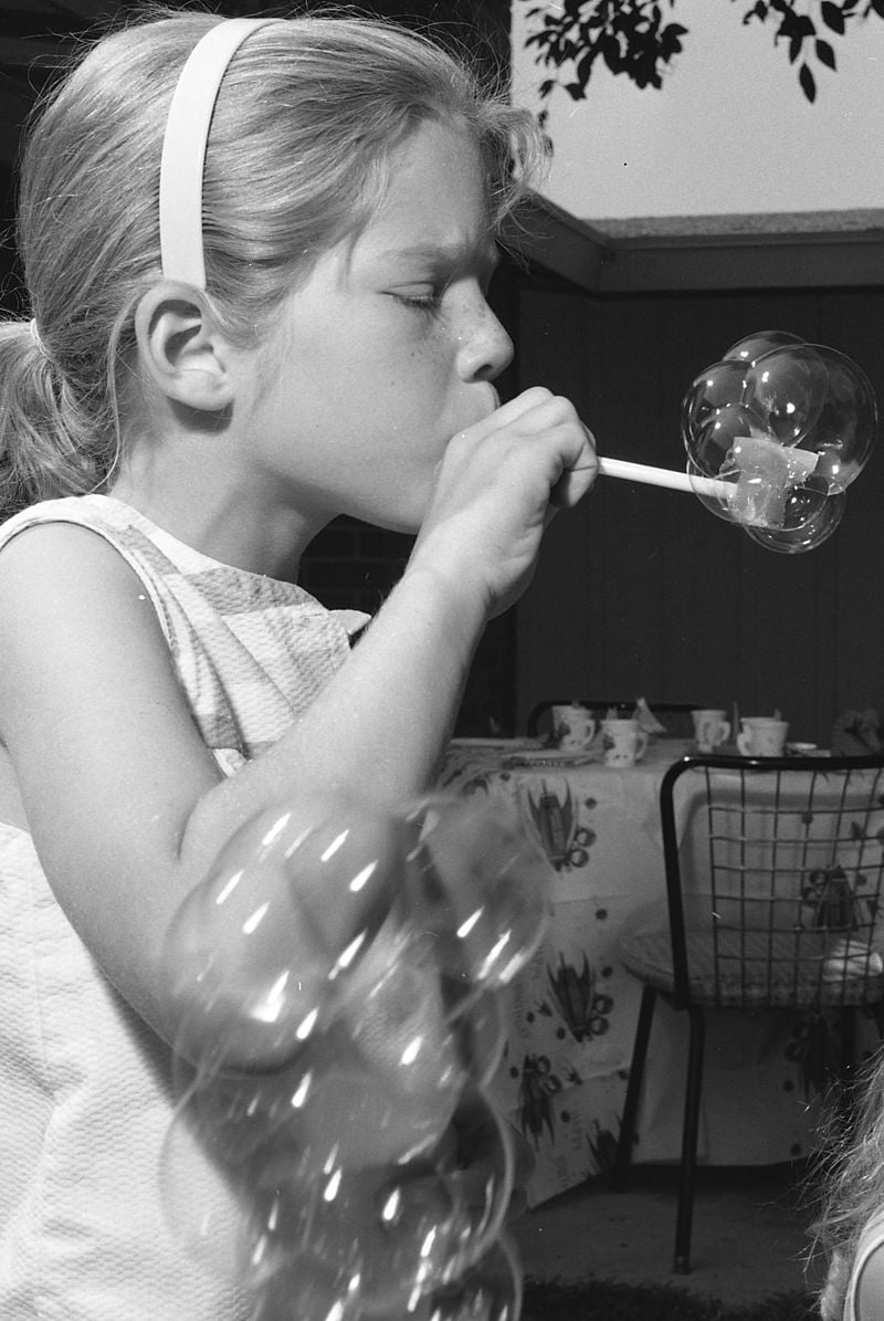 Child_blowing_bubble_pipe_1962.jpg