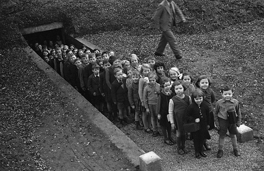 Children_outside_air_raid_shelter_Gresford_4365436432.jpg