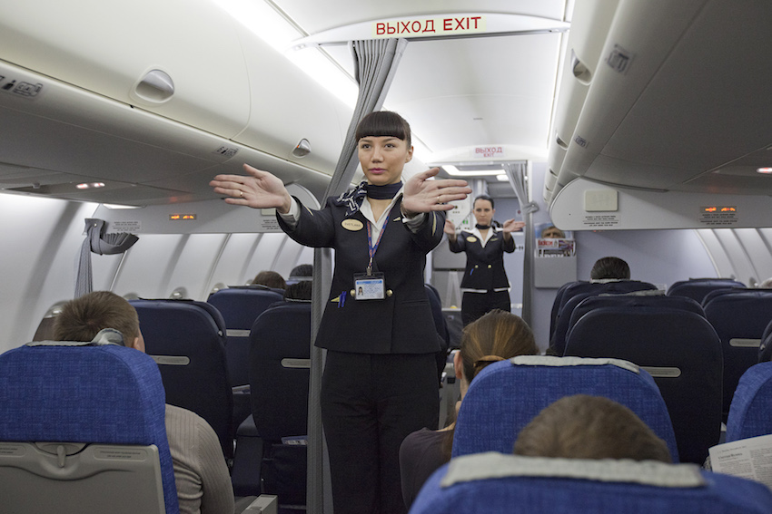 Flight_attendants_performing_a_pre-flight_safety_demonstration_on_an_Aeroflot_Sukhoi_Superjet.jpg