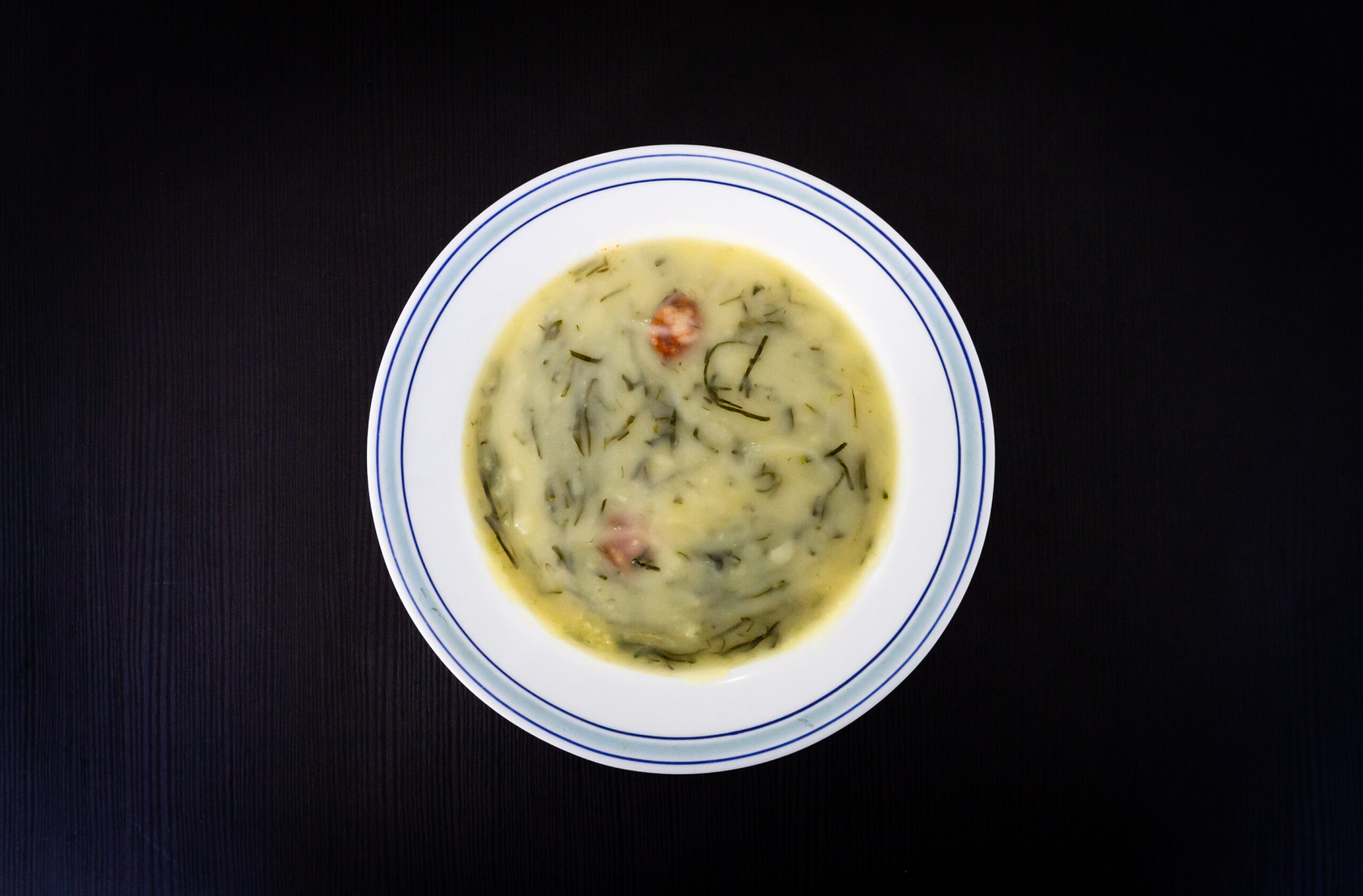 Caldo Verde Soup on Black Wooden Background