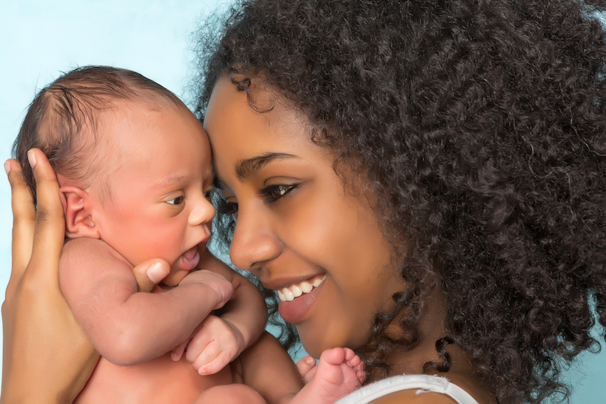 Smiling african mother and baby