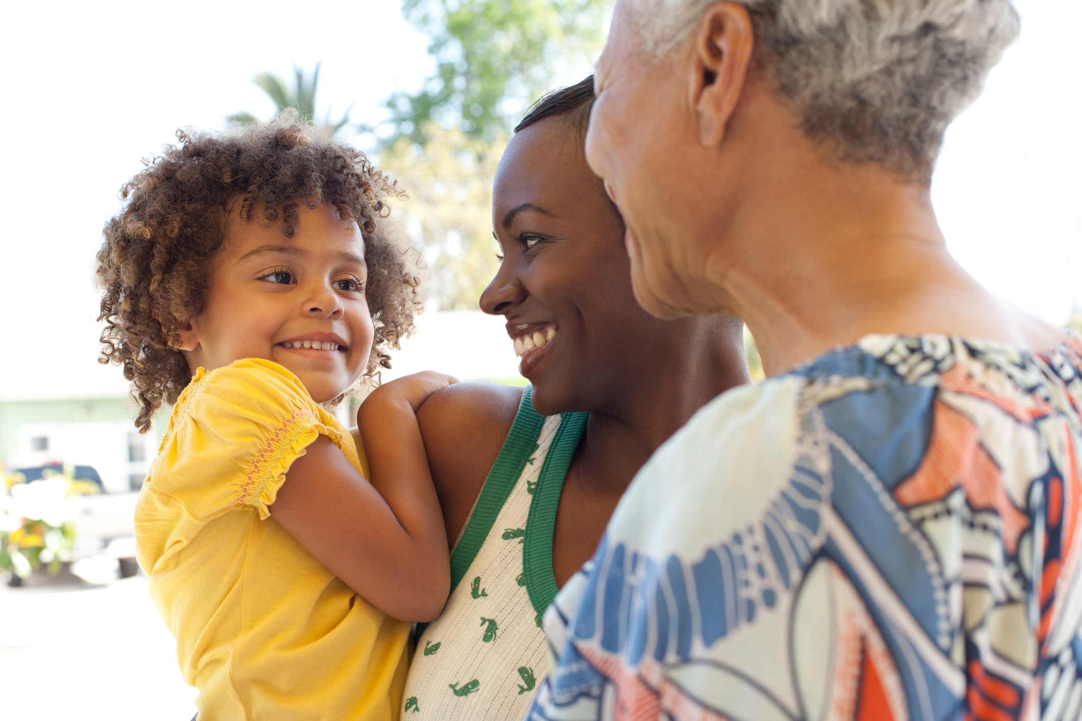 Three generations of women bonding outdoors