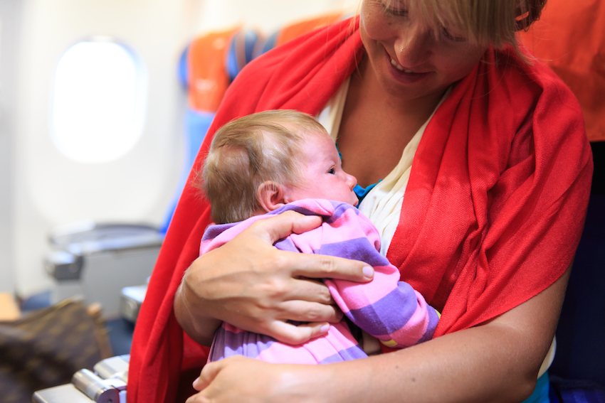 mother and infant daughter travel by plane