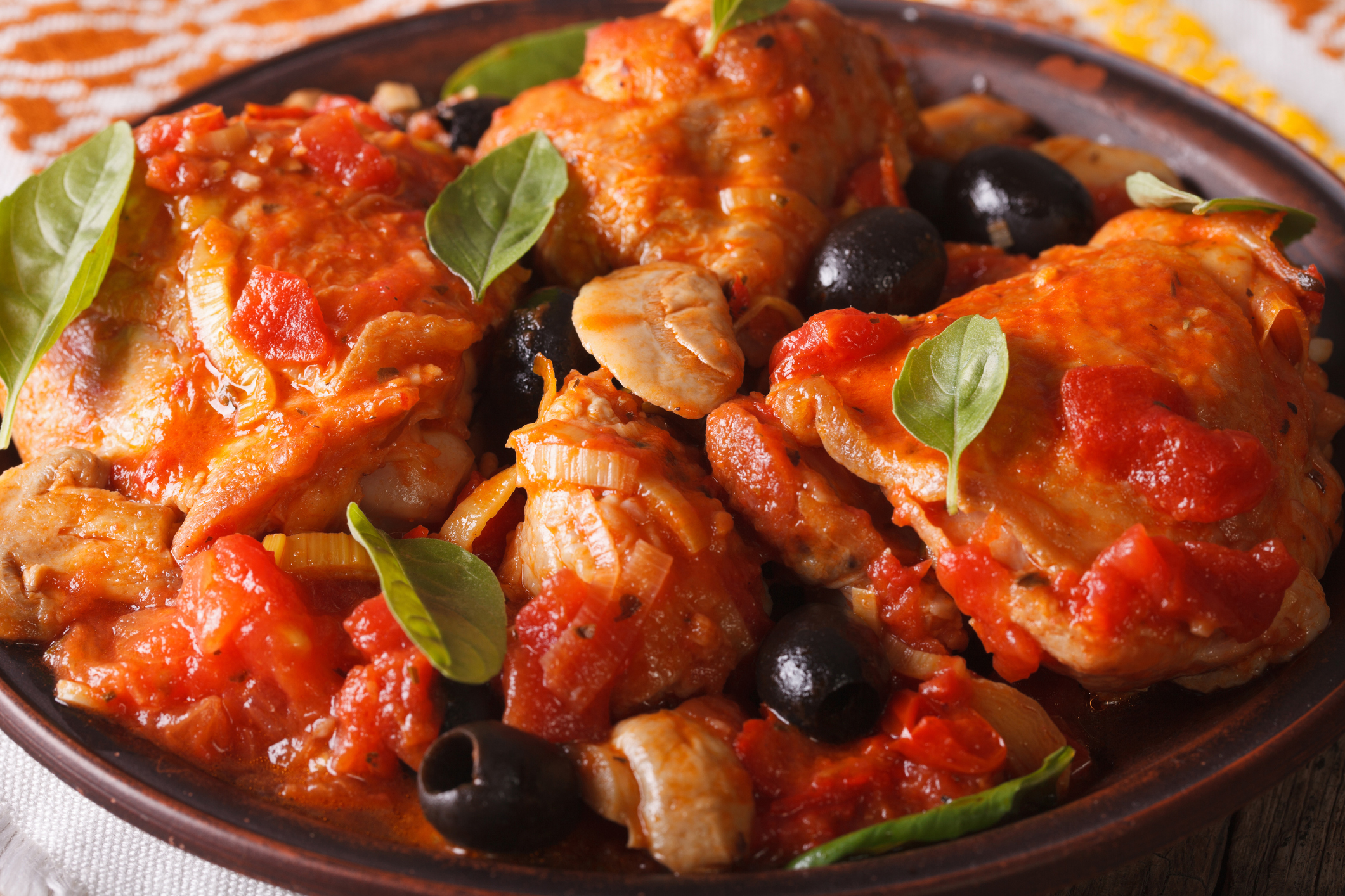 Italian food: Chicken Cacciatori on a plate close-up. horizontal