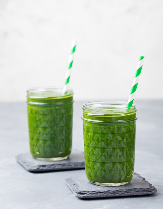 Spinach smoothie Healthy drink in glass jar. Copy space