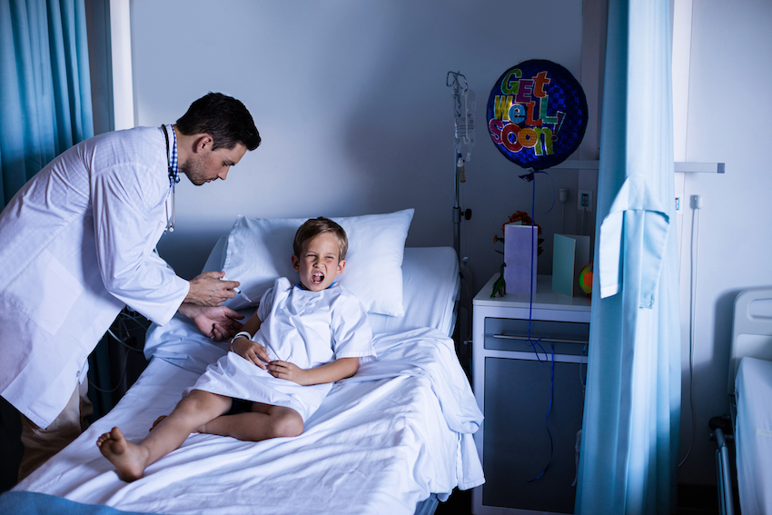 Male doctor injecting patient