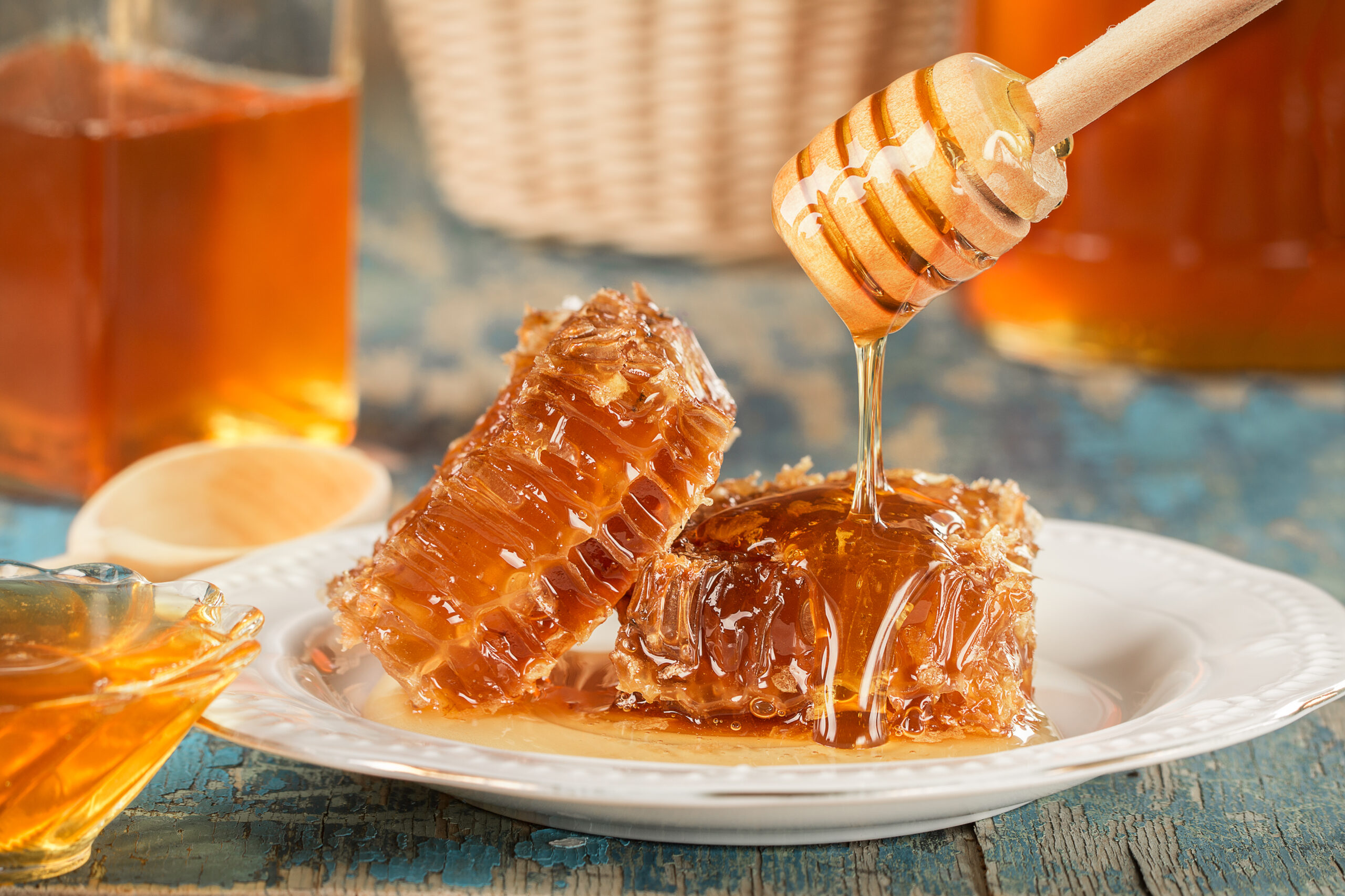 Sweet honeycomb and wooden Honey dripping