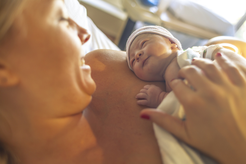 New born baby with his mother