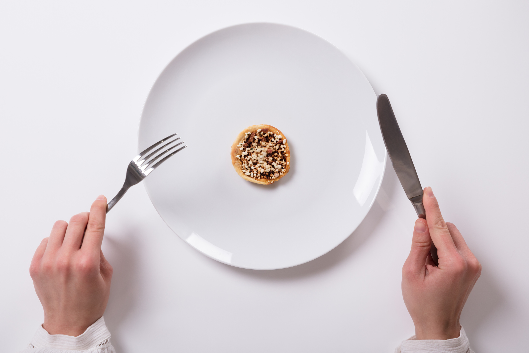 Woman's Hand With Fresh Food On Plate