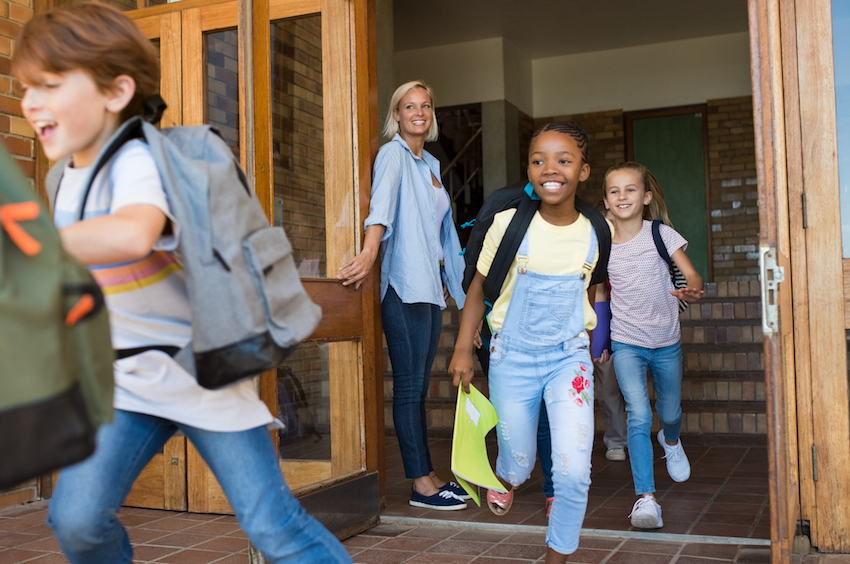 Children running outside school