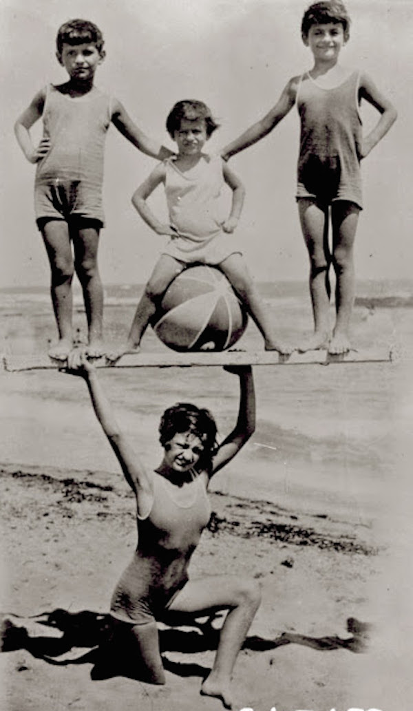 Holding-up-children-on-the-beach-1931-1.jpg