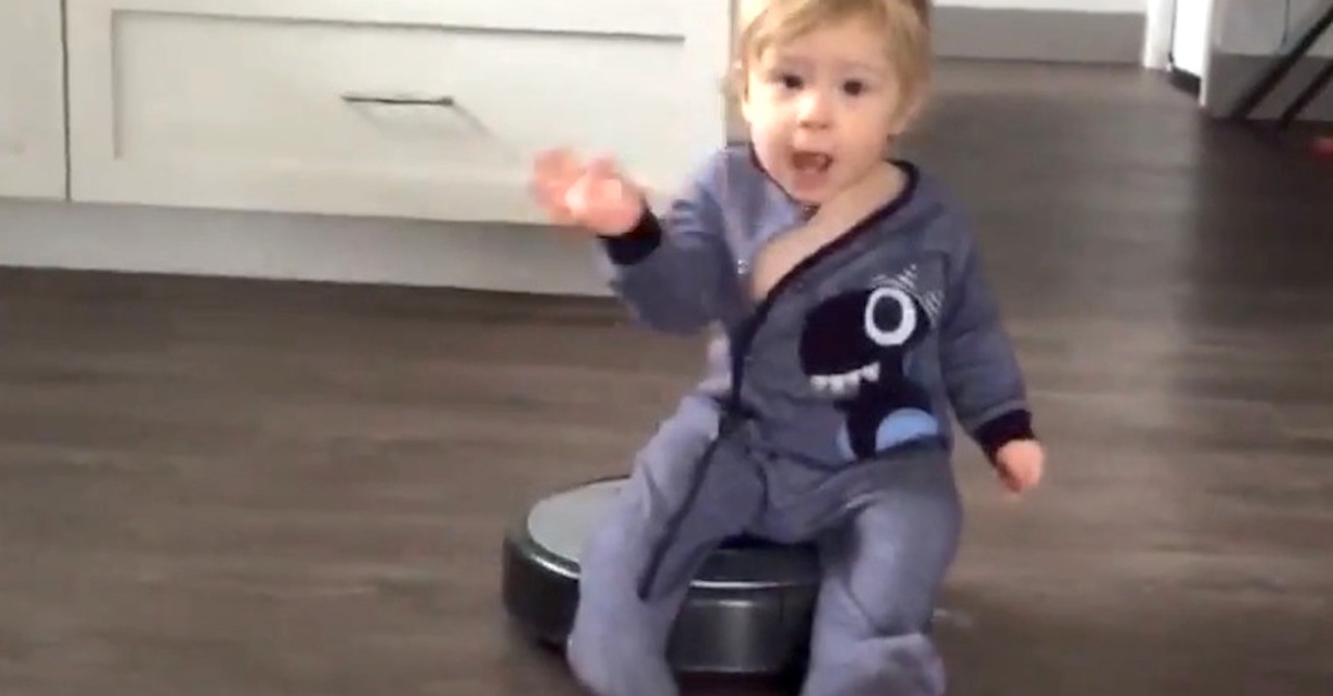 Little Boy Goes For a Ride on a Roomba AFV