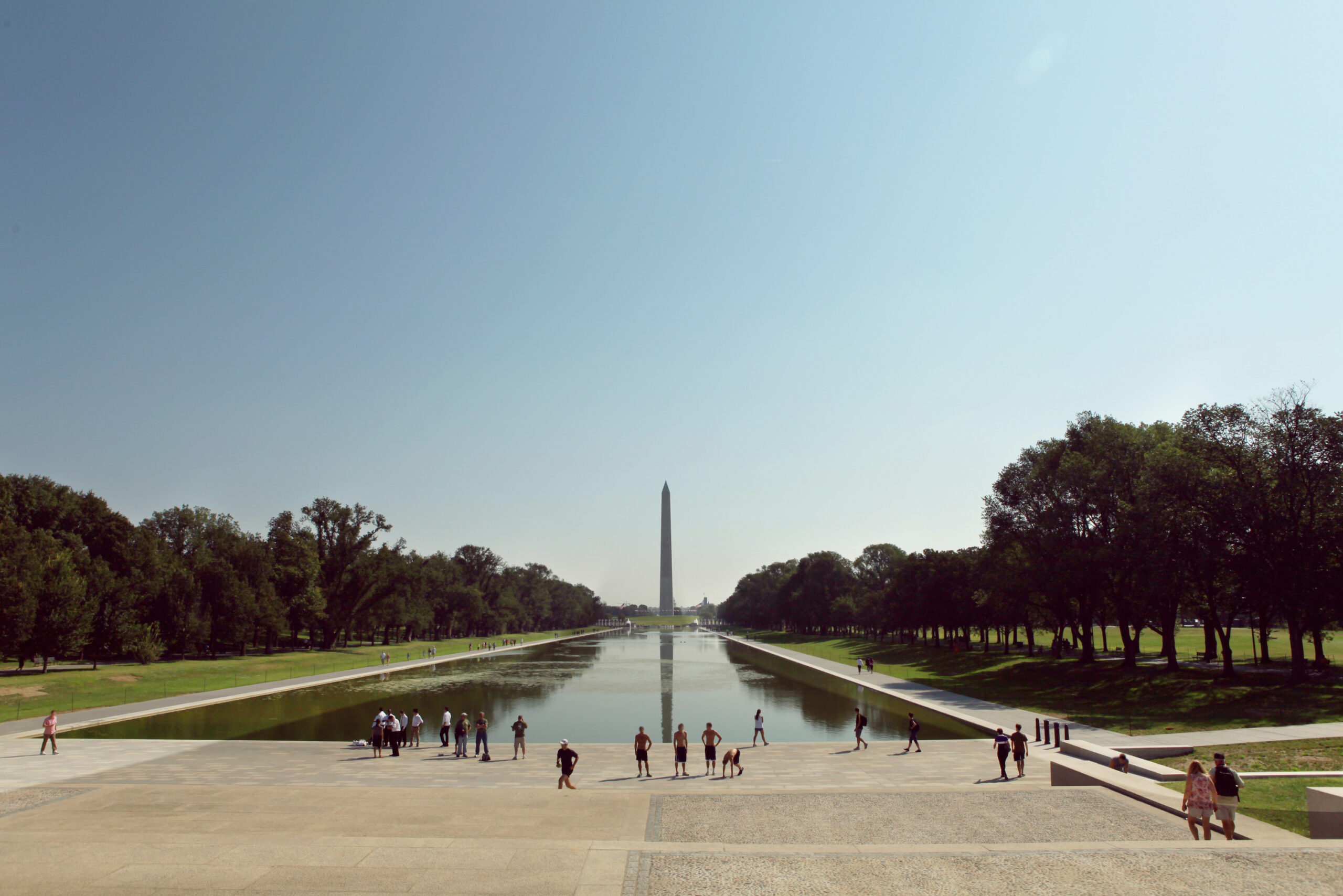Tourists at Lincoln Memorial Park against clear blue sky
