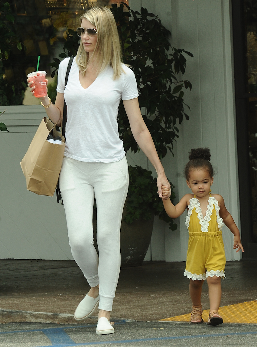 Paige Butcher, girlfriend of Eddie Murphy and their daughter Izzy are spotted as they grab a drink while out shopping in Beverly Hills, ca