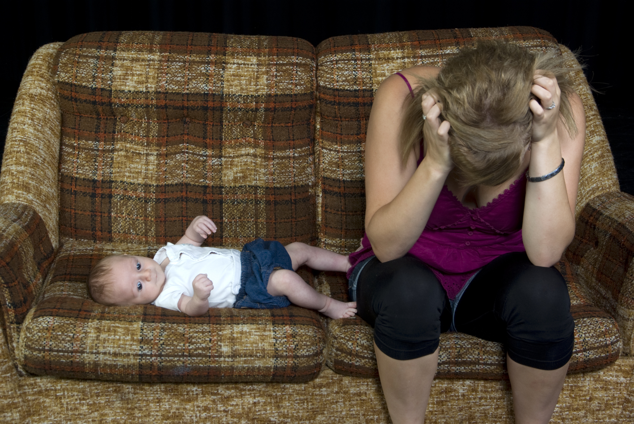 Teenager or young adult with newborn baby