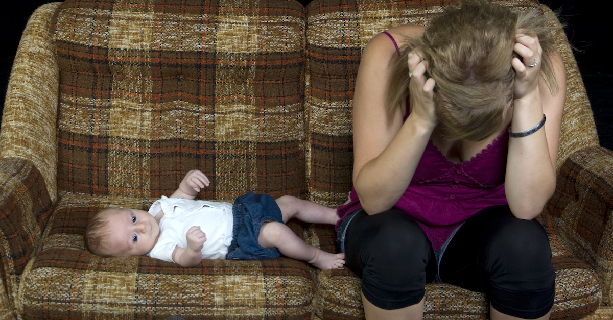 Teenager or young adult with newborn baby