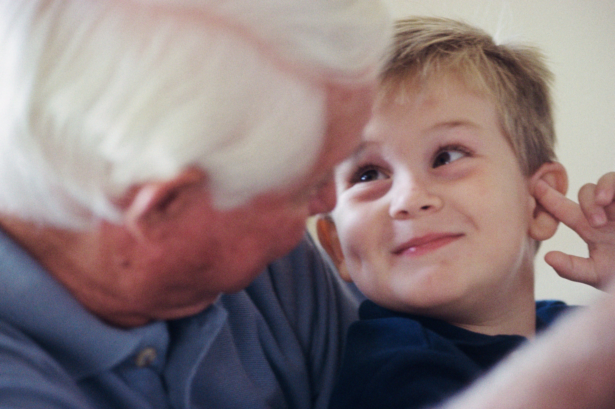 grandfather and grandson smiling