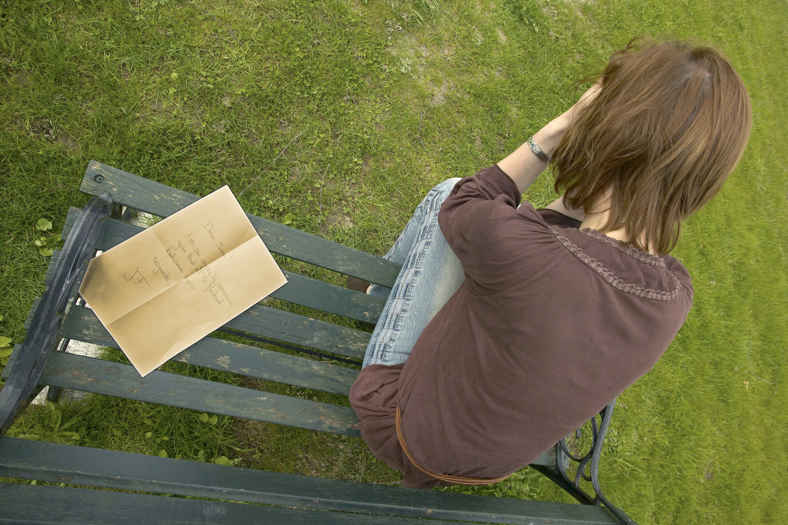 Depressed Woman Sitting on Park Bench