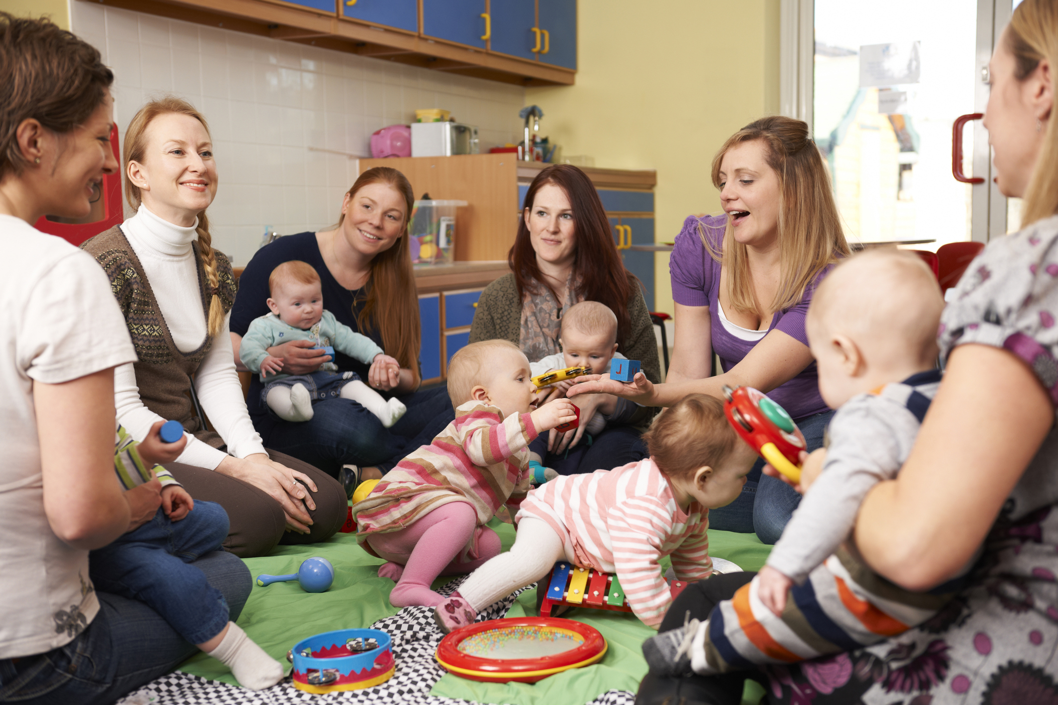Group Of Mothers With Babies At Playgroup Group Of Mothers With Babies At Playgroup