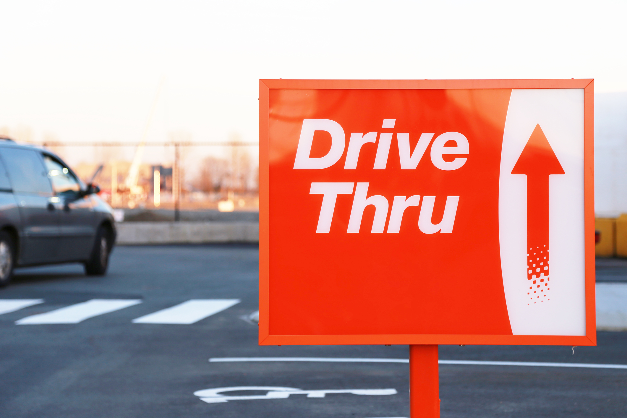 Red and white Drive Thru street sign