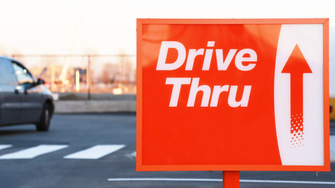 Red and white Drive Thru street sign