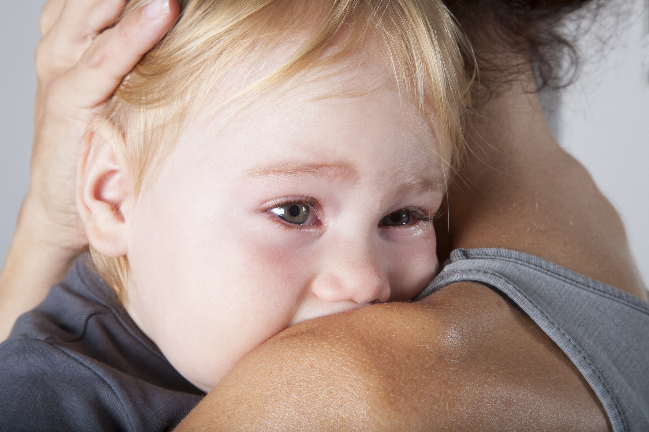 tears in baby eyes embraced mother