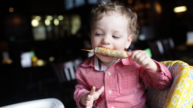 Boy eating kebab