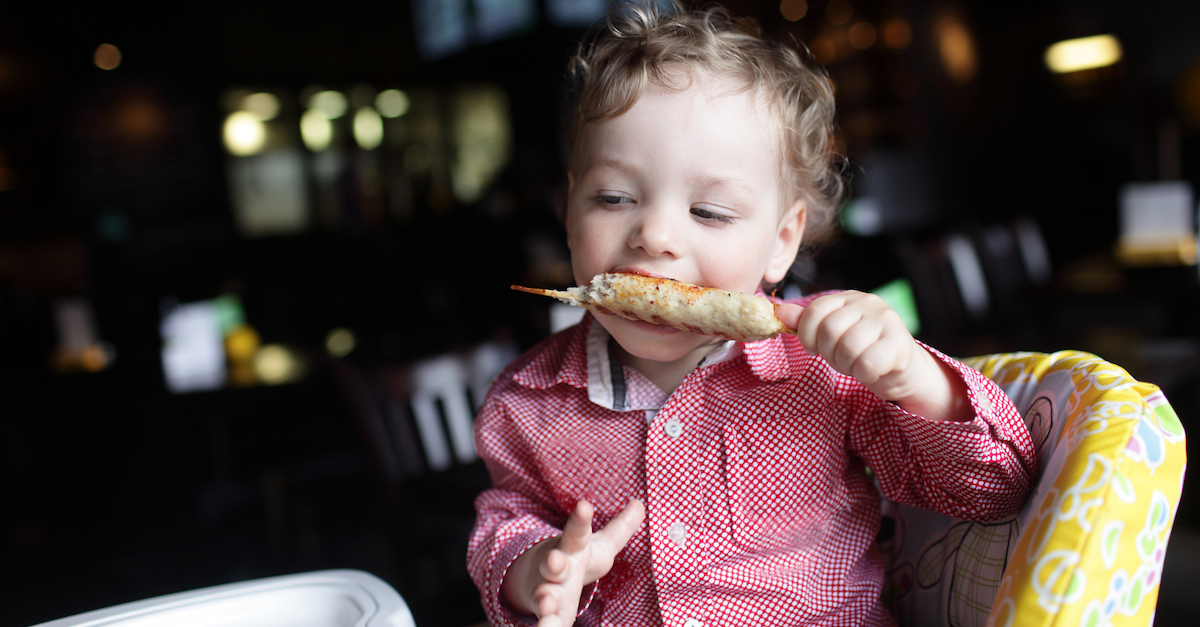 Boy eating kebab