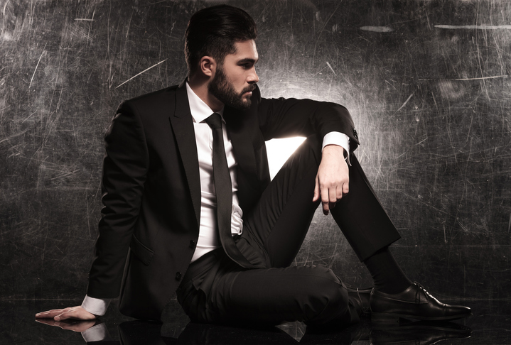 side of an elegant business man in black suit