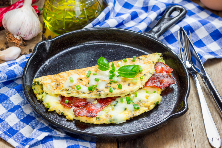 Bacon stuffed omelette on a iron cast pan