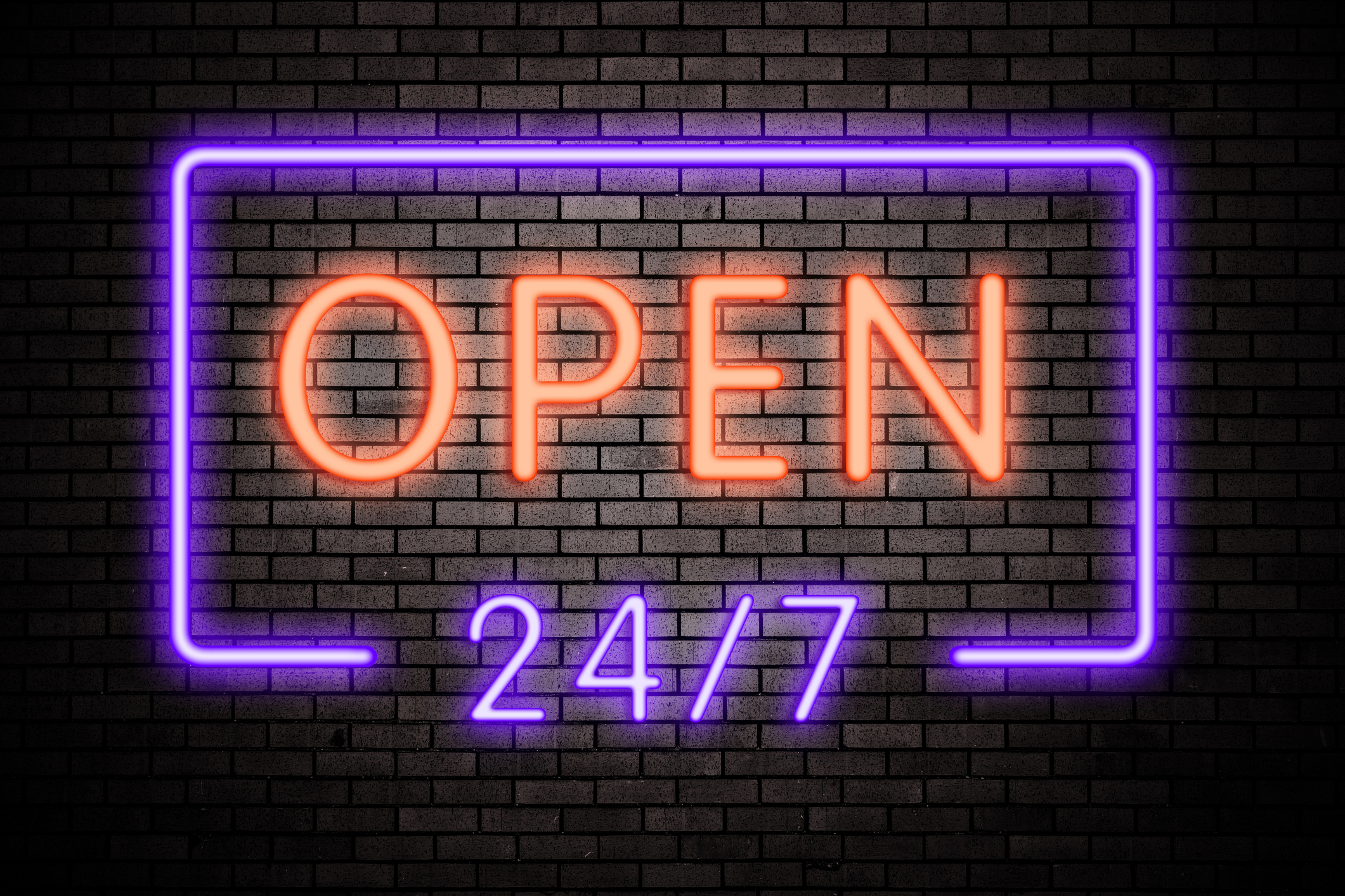 Open 24 hours neon light on brick wall Open 24 hours neon light on brick wall