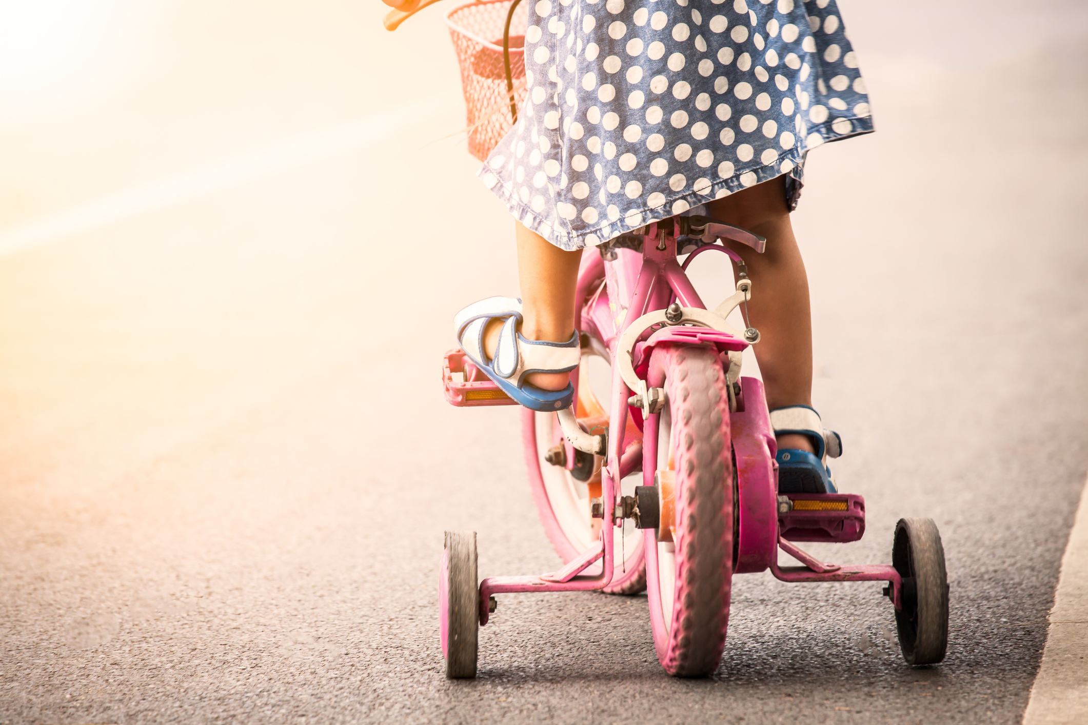 Child cute little girl riding bike in park Child cute little girl riding bike in park