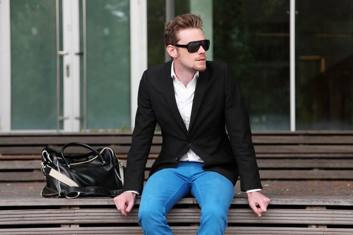 Man sitting outside wearing sunglasses