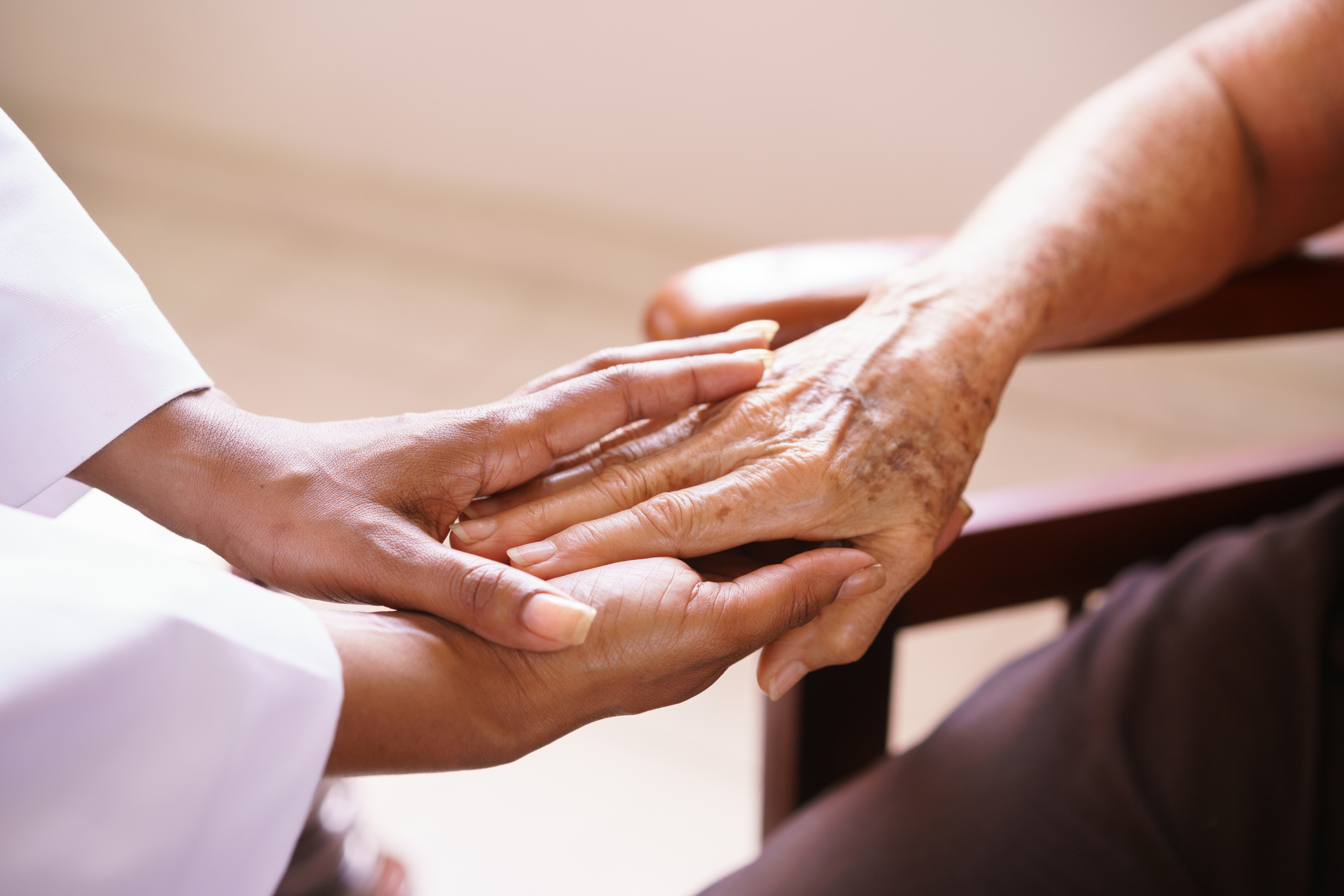Senior Woman Talking With Black Doctor In Hospice Senior Woman Talking With Black Doctor In Hospice