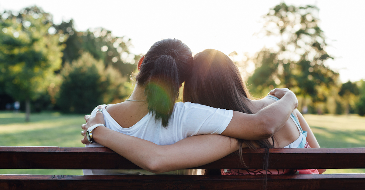 Mom and daughter embracing