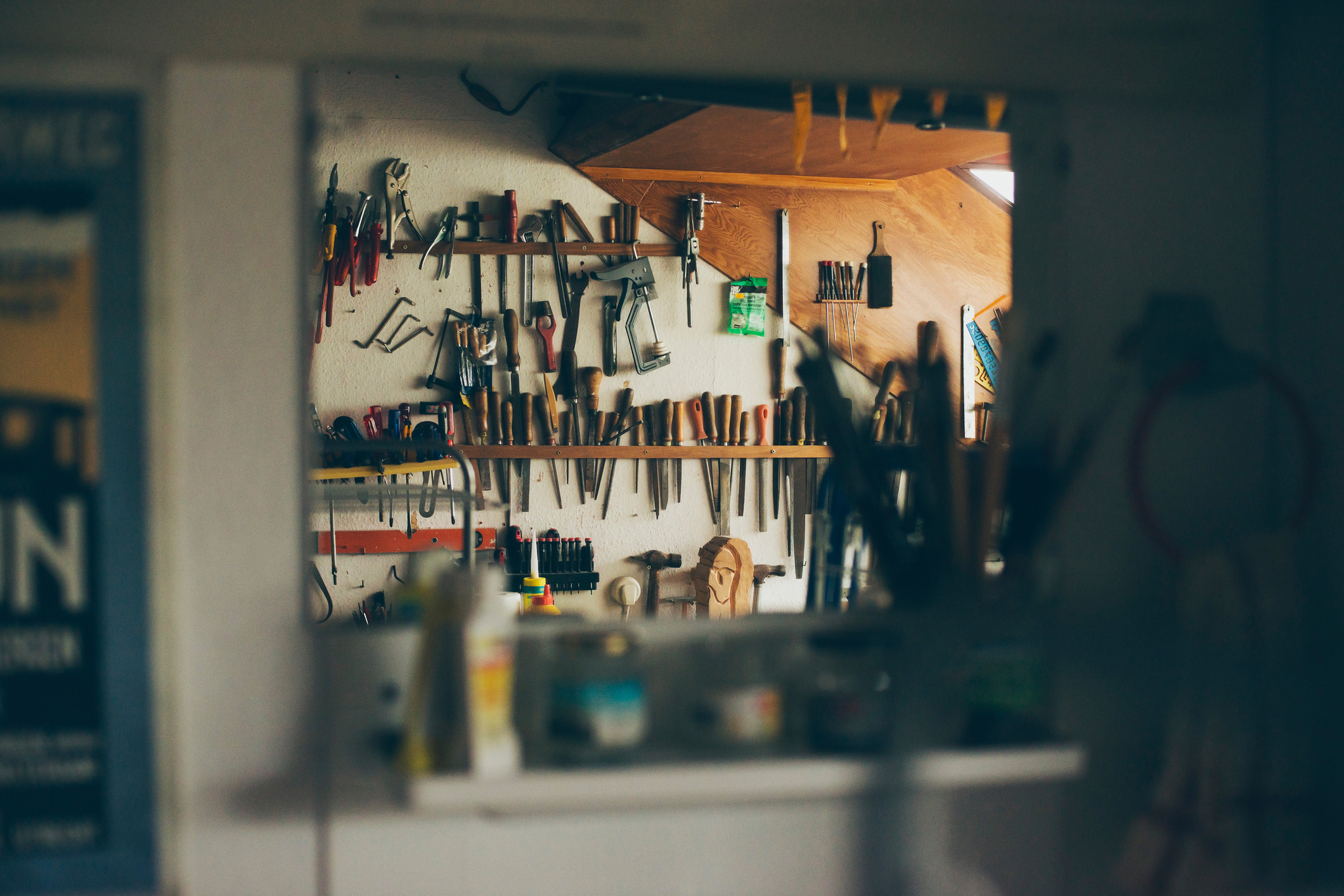 Wall with tools seen in mirror