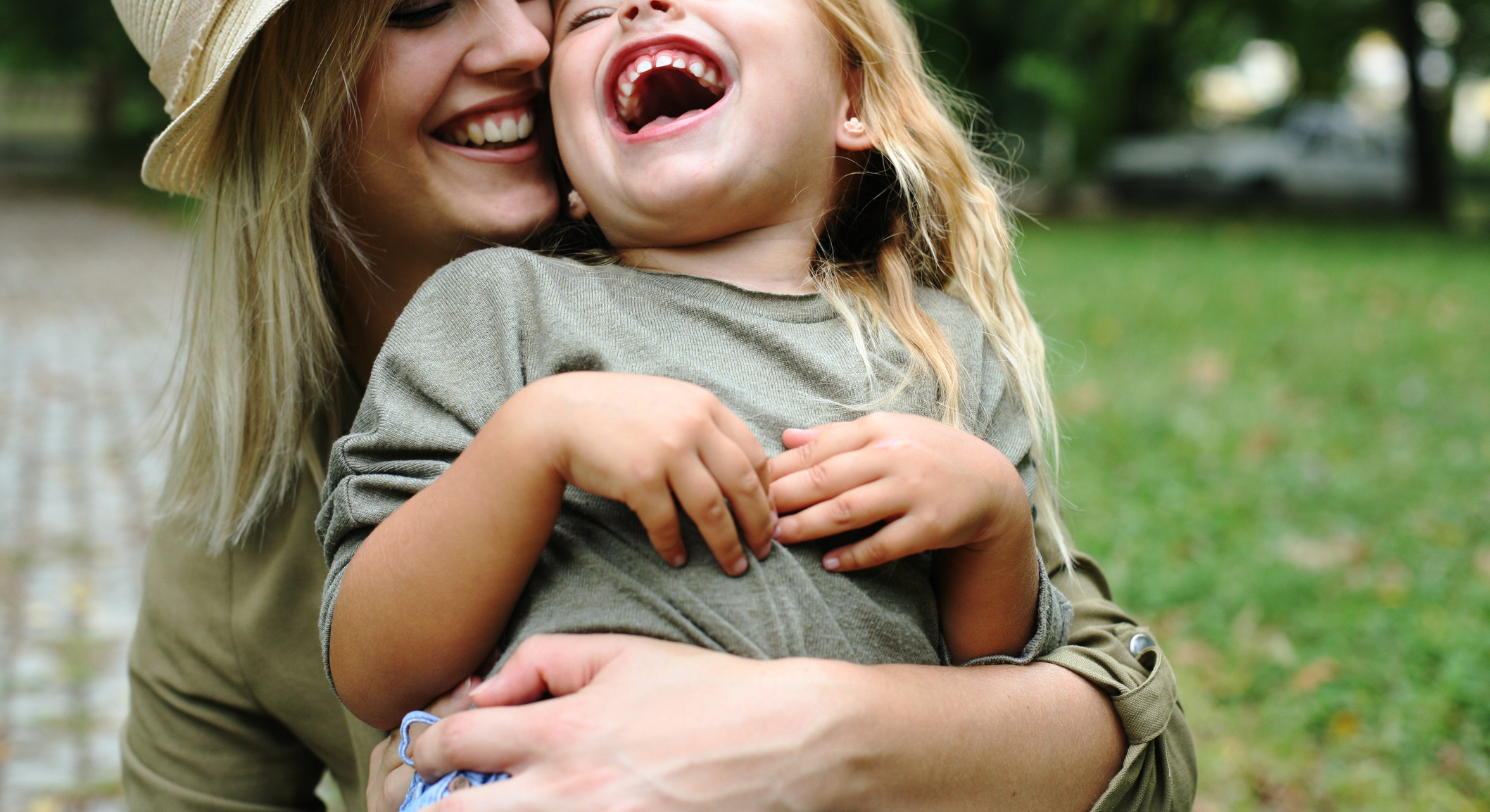 Cheerful mother with her daughter outdoor.